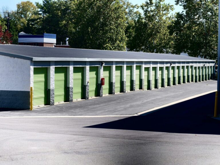 Row of green roll-up storage unit doors
